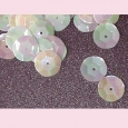 A packet of white circular 6 sided vintage irridescent sequins